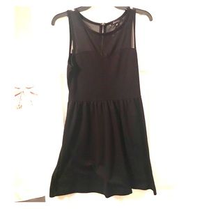 Black sleeveless shear neckline dress